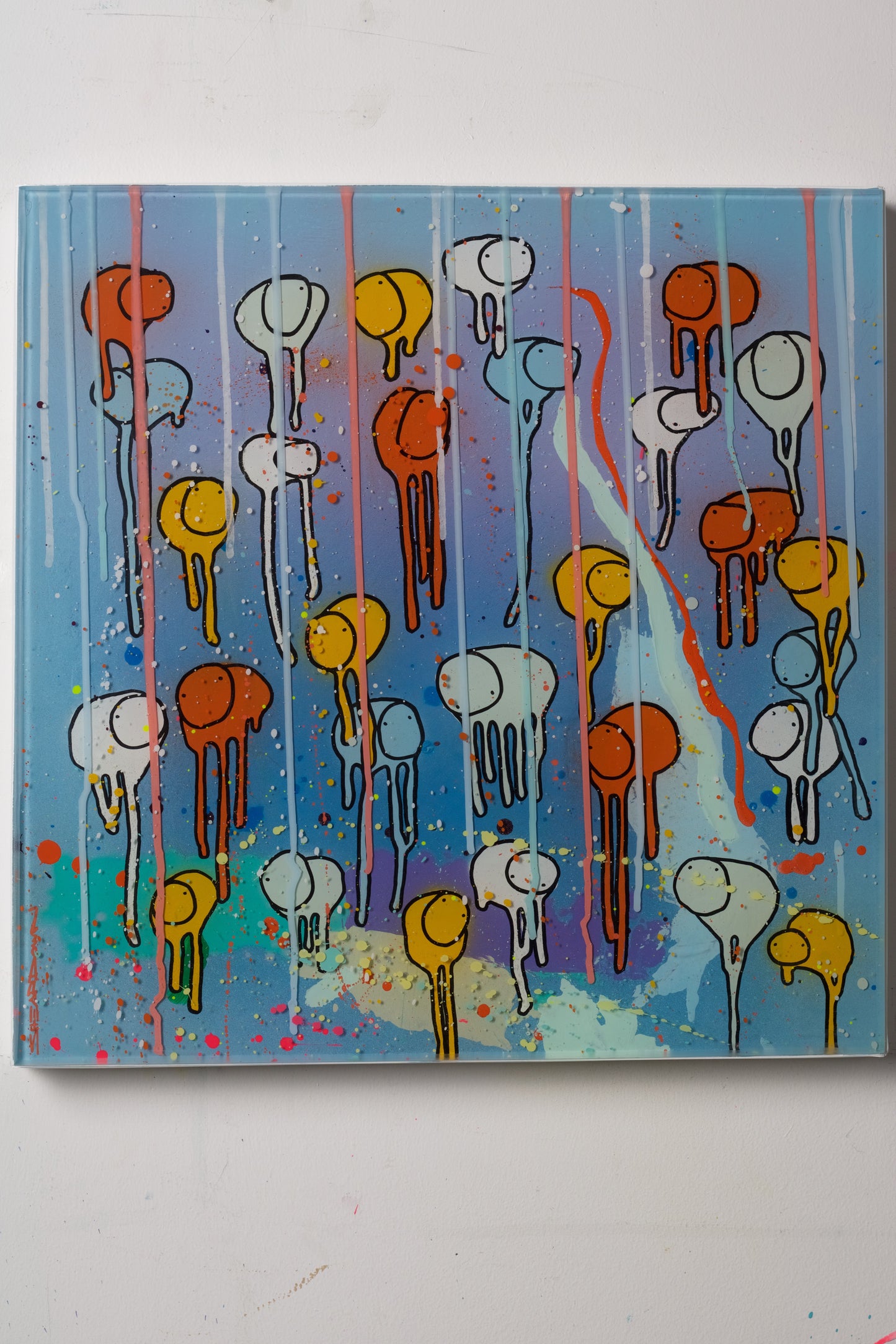 Abstract orange and blue art piece with colorful shapes on a blue background