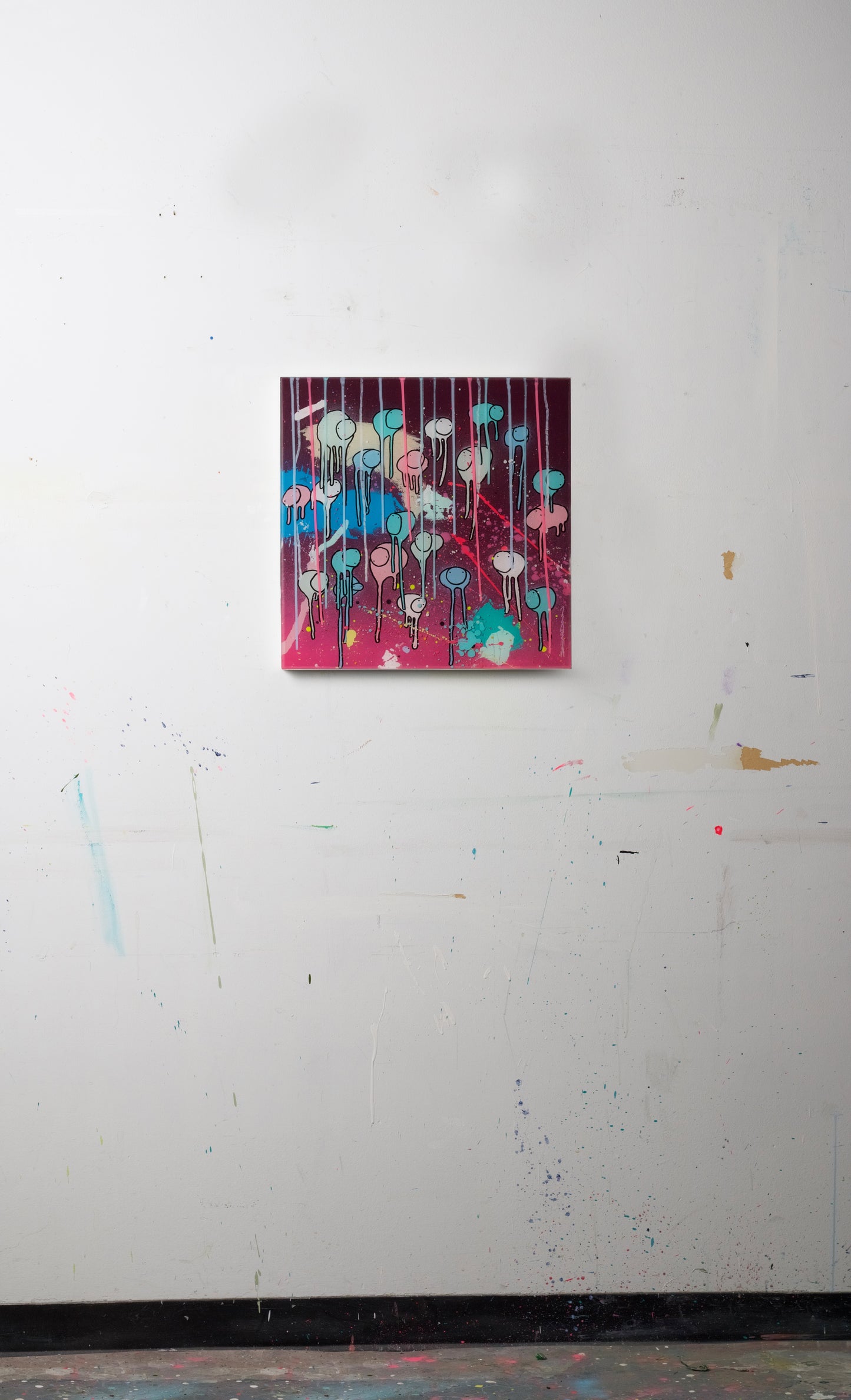 20"x20" RAINING COWS painting hung on a white studio wall.