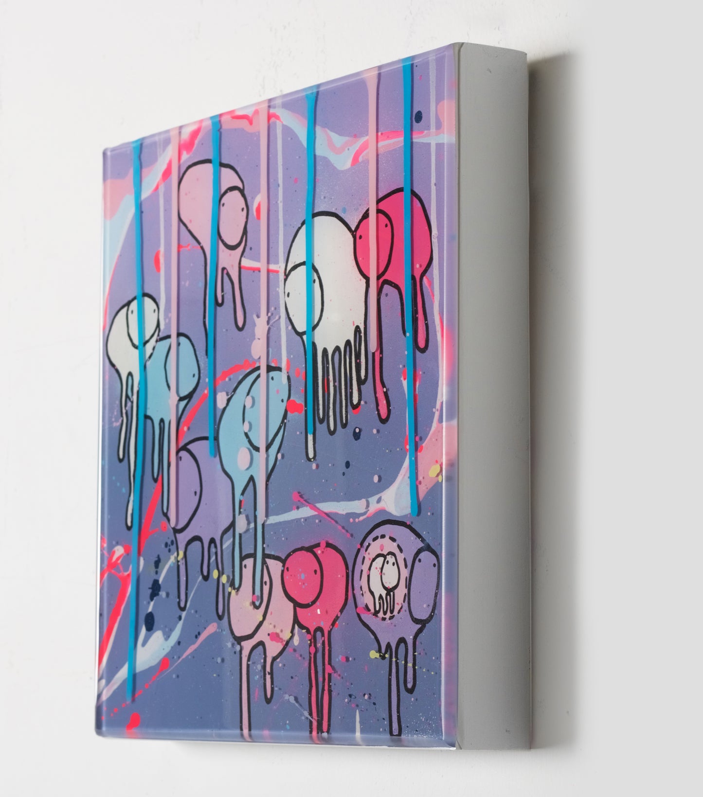 Side view of painting ‘RAINING COWS Purple Alley Streets’ by Toronto artist Morgan Sheardown hanging on a white wall, showing colorful purple, pink, and baby blue swirls, dripping paint, and cows.