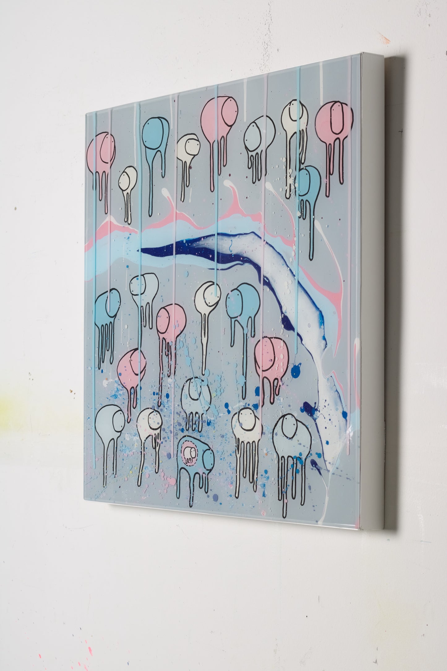 A colorful artwork featuring a herd of stylized cows with abstract and surfer-inspired designs, set against a multi-layered painted resin background with blue and pink splashes.