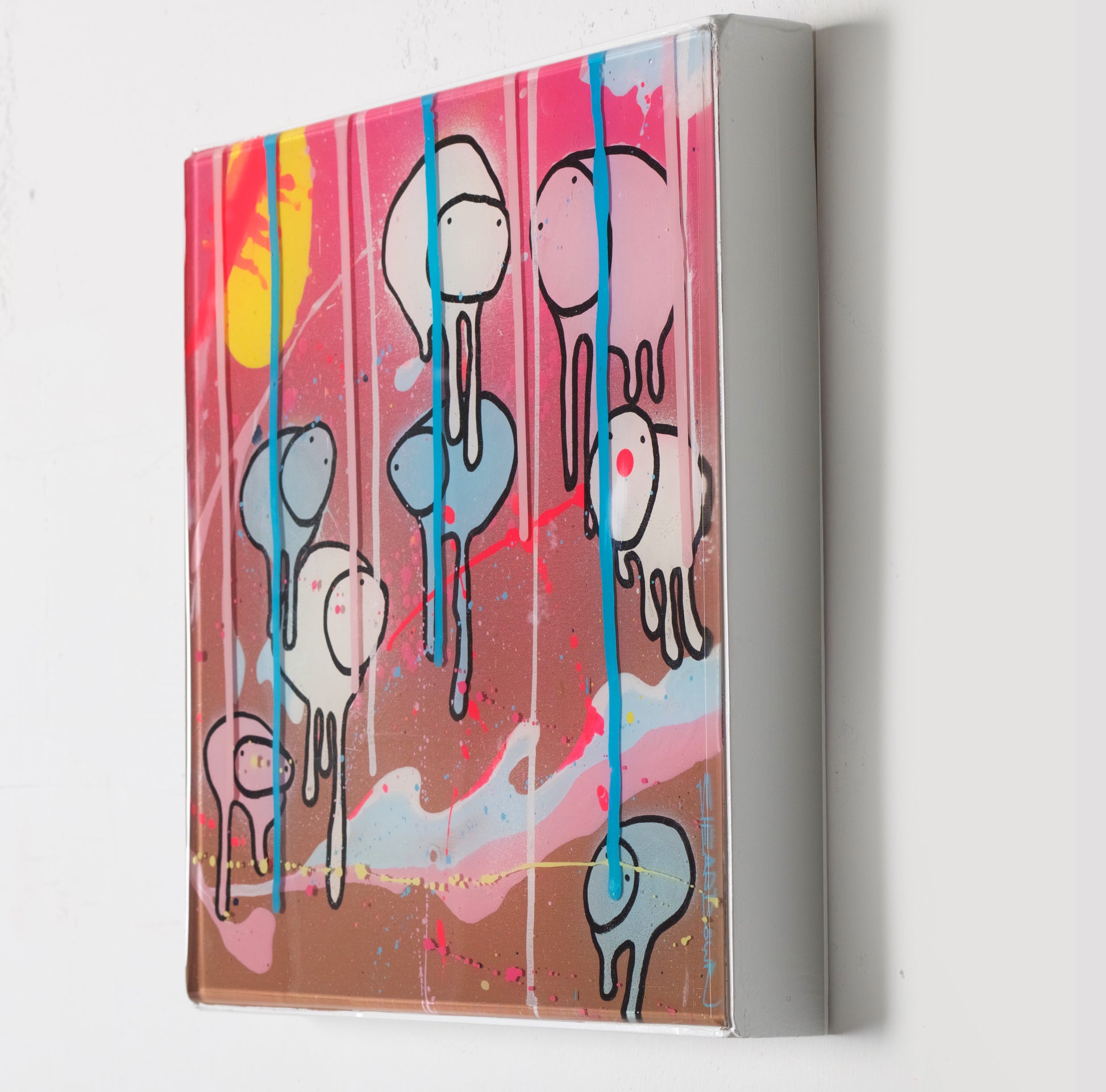 Side view of painting RAINING COWS 'Loose Ends' by Toronto artist Morgan Sheardown hanging on a white wall, showing colorful brown, pink, and white swirls,  yellow sun, and cows.